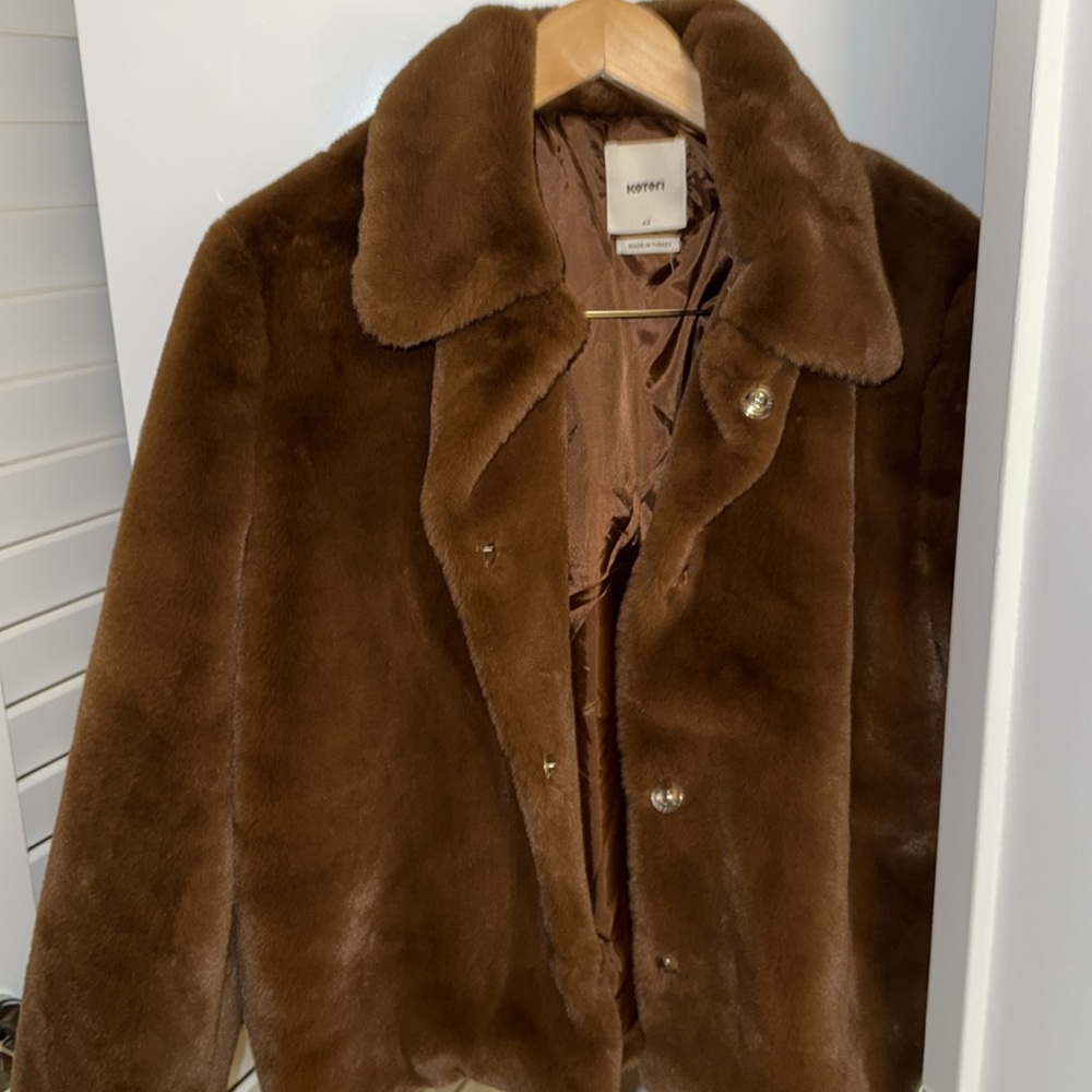 Brown shearling jacket. Looks new. No signs of wear